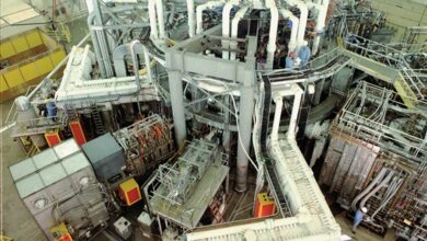 The TFTR tokamak fusion reactor hall with its ring of magnets and pipework