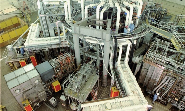 The TFTR tokamak fusion reactor hall with its ring of magnets and pipework