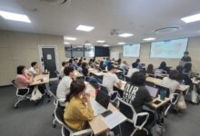 Students in a classroom with smartphones put away during a lesson