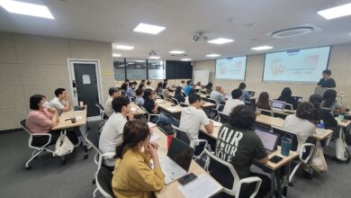 Students in a classroom with smartphones put away during a lesson