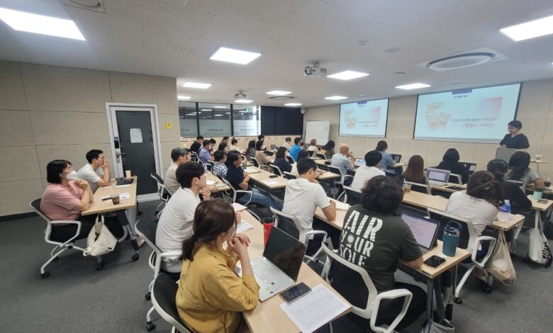 Students in a classroom with smartphones put away during a lesson